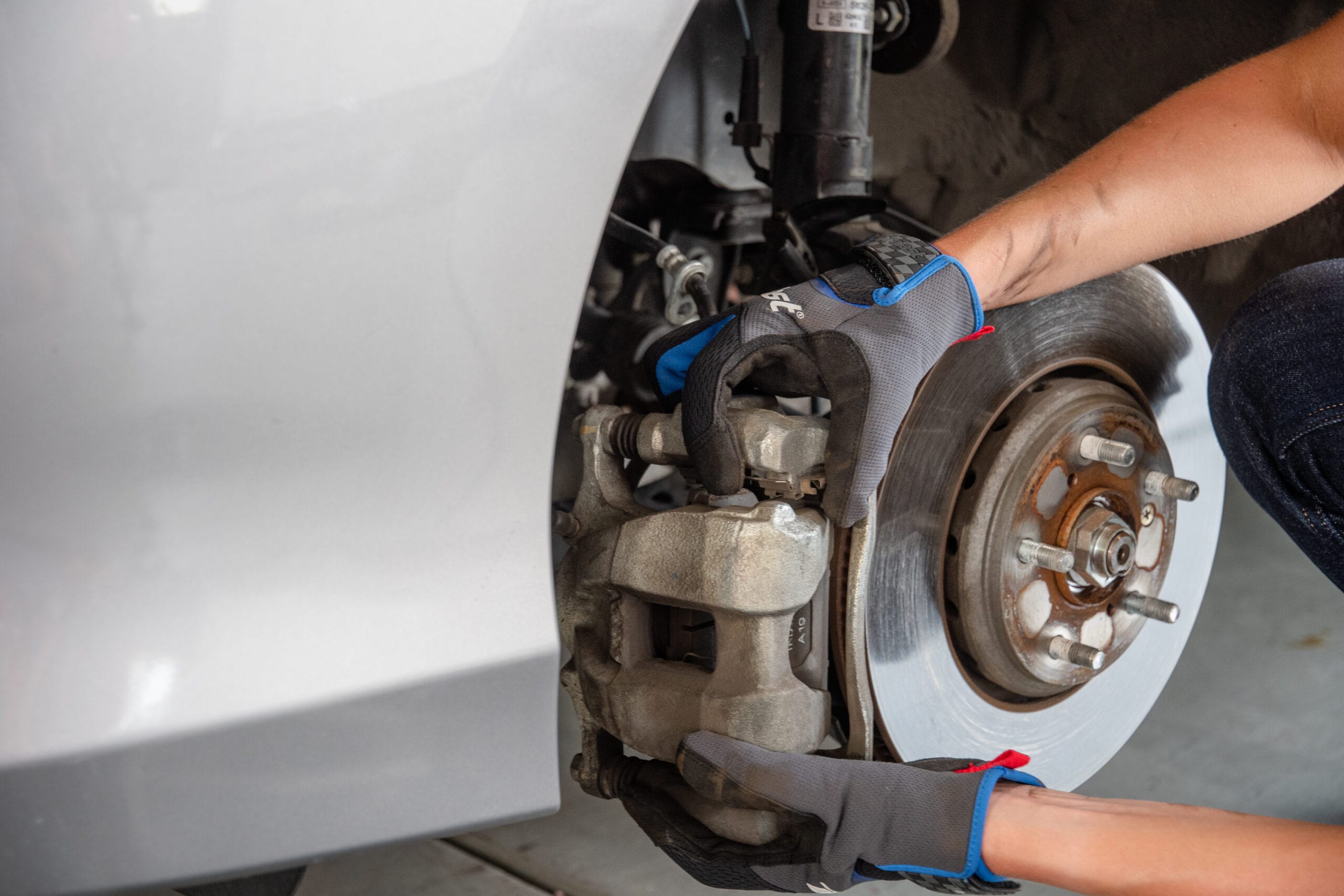 removing-brake-caliper-from-car